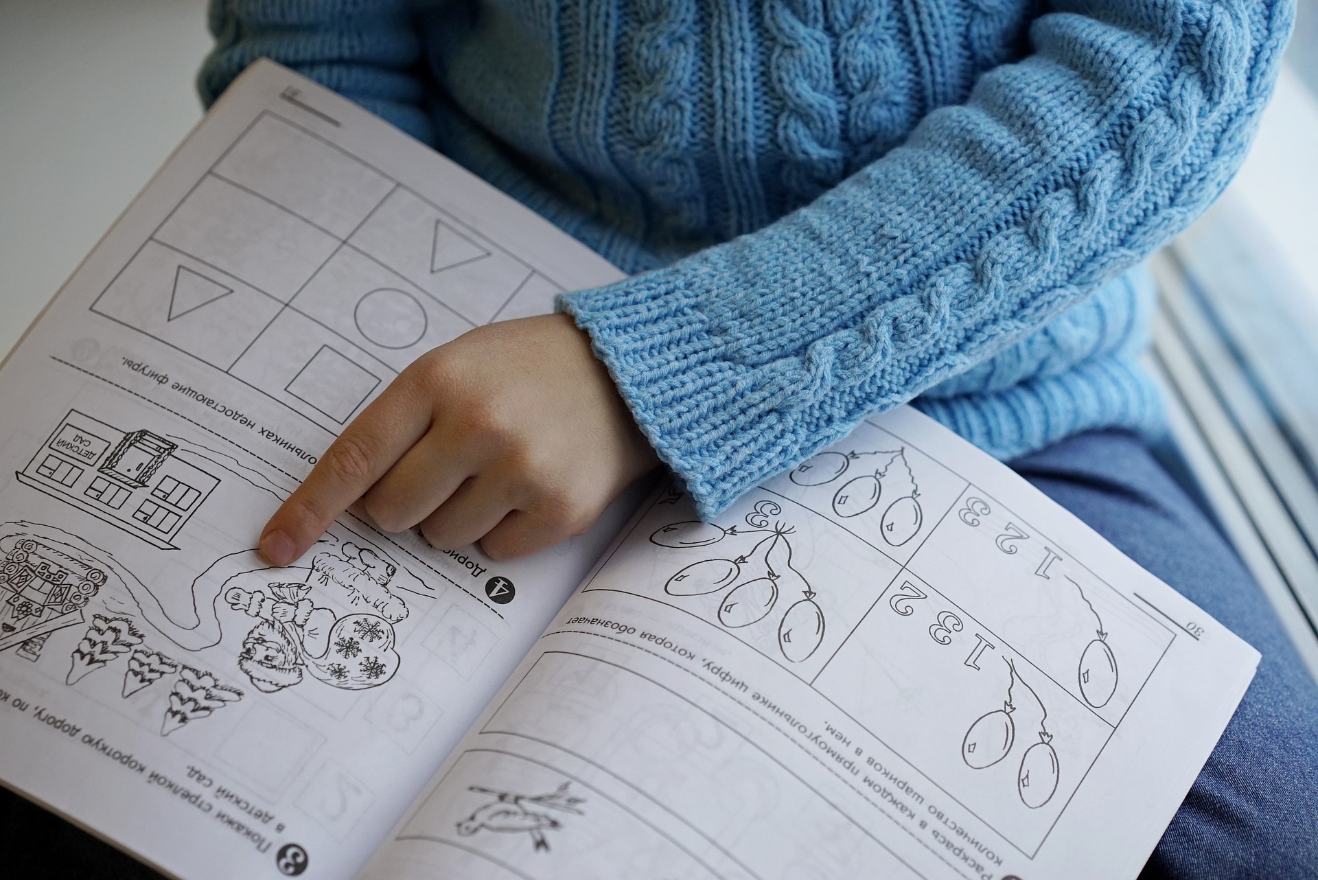 Child practicing reading words